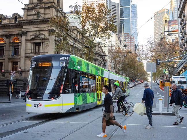 MELBOURNE, MAY 28, 2024: Street scene recreations - Looking east along Collins Street, Melbourne Town Hall at left of frame. Picture: Mark Stewart