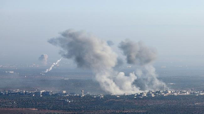 Smoke billows from the site of clashes and mutual shelling between Syrian jihadists and allied factions and regime forces in Syria's Aleppo province on Thursday. Picture: Omar Haj Kadour / AFP