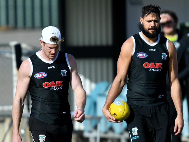 Tom Jonas and Paddy Ryder train away from the main group due to injury during a Port Adelaide Port Power Training session at Alberton Oval in Adelaide, Tuesday, July 24, 2018. (AAP Image/Kelly Barnes) NO ARCHIVING