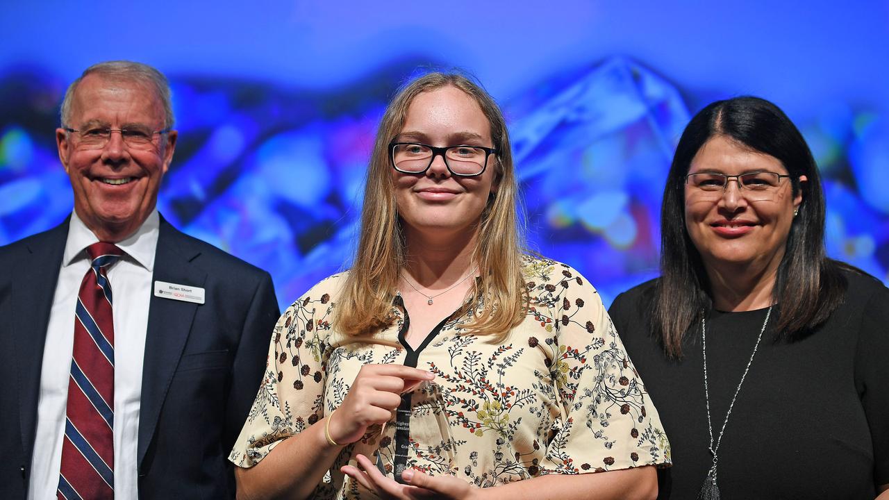 Student Grace Kennett with chairman of QCAA Brian Short and MP Grace Grace. Ms Kennett achieved the highest result on the 2018 Queensland Core Skills Test. Picture: AAP/John Gass