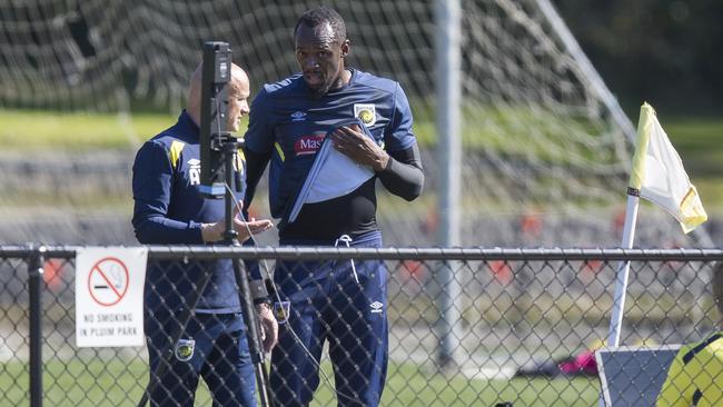 Usain Bolt with Central Coast Mariners’ Head of Performance Andrew Young on Wednesday. Picture: Dylan Robinson