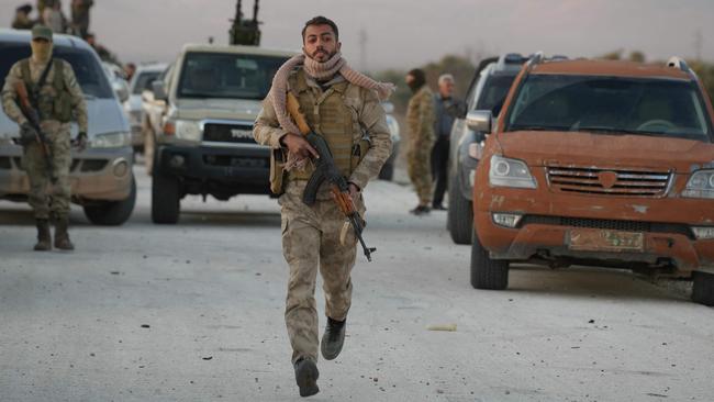 Anti-government fighters reach the highway near the northern Syrian town of Azaz, about 32km northwest of Aleppo. Picture: Rami al Sayed / AFP