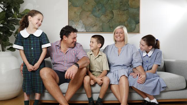 Emily and Sam Manion from Roseville send their three children, (from left) Iris, 5, Hugo, 9, and Fleur, 11, to Catholic Schools. Picture: Jonathan Ng