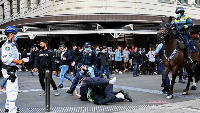 Protesters clash with NSW Police officers at Town Hall during a protest to rally for freedom of speech, movement, choice, assembly, and Health in Sydney. Picture: NCA NewsWire/Bianca De Marchi