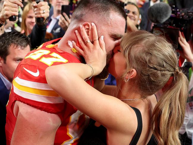 Taylor Swift kissing boyfriend Travis Kelce at the Superbowl wearing a Dion Lee corset. Picture: Ezra Shaw/Getty Images
