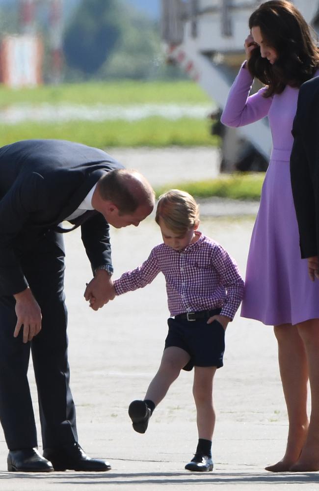 Even Prince George’s shirt matches his mother’s purple frock. Picture: AFP