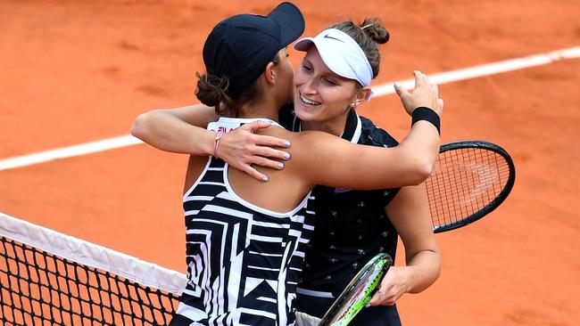 The new world No.2 embraces Marketa Vondrousova at the net. Picture: Getty Images