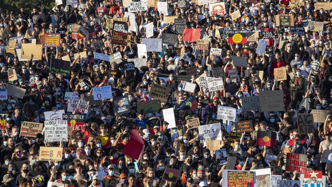 Protesters participate in a Black Lives Matter rally in Brisbane on Saturday. Picture: AAP Image/Glenn Hunt