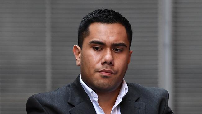 Sateki Siale is led to a waiting prison services vehicle at the Supreme Court in Sydney. Picture: AAP Image/David Moir