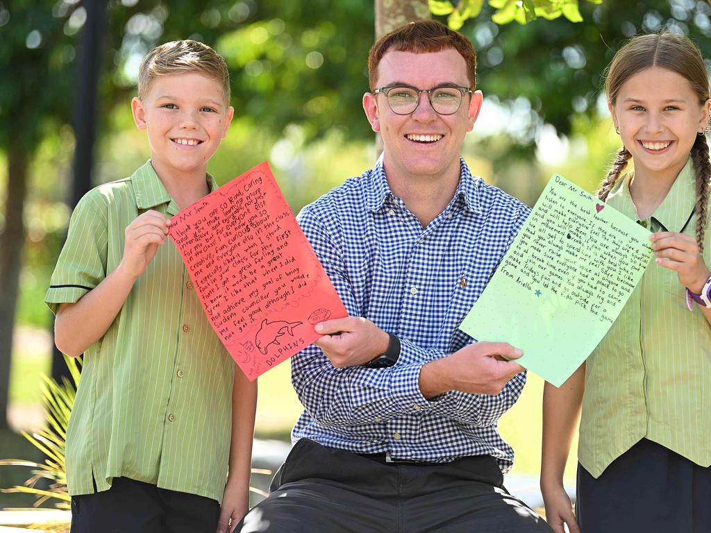 1/5/2024: Mango Hill State School, yr 5 students, Duke Migala 10 and Ariella Dalzell 10, with their favourite teacher Harry Smith who taught them in yr 4, holding the letters they wrote to him, Mango Hill, Brisbane. pic: Lyndon Mechielsen/Courier Mail