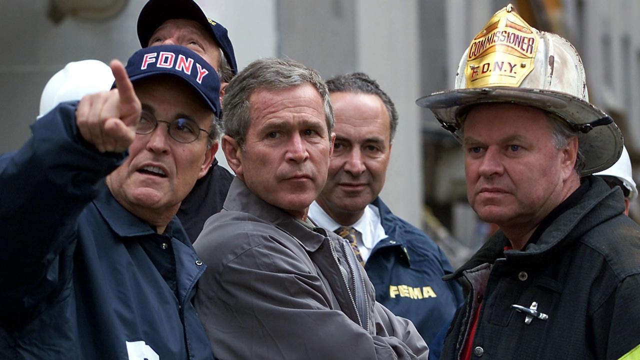 Rudy Giuliani with George W. Bush at the site of the former World Trade Centre five days after 9/11.