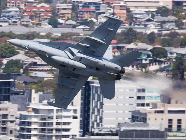 A Royal Australian Air Force EA-18G Growler flies through Brisbane. Picture: Beau Chenery