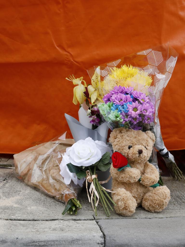 Flowers and a teddy bear were left at the scene of the incident. Picture: Robert Lang