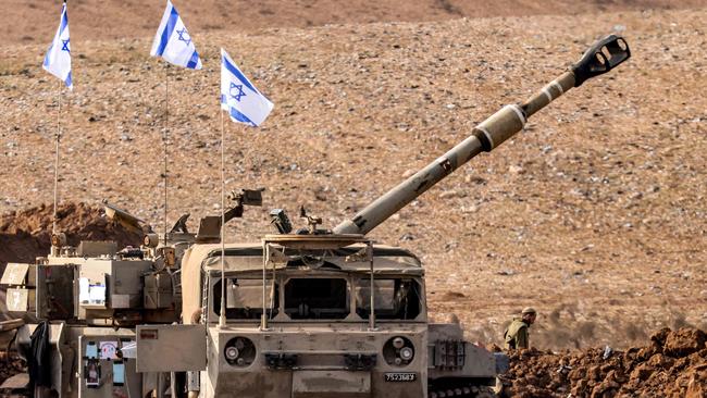 An Israeli army M109 155mm self-propelled howitzer is deployed at a position along the border with the Gaza Strip near Sderot in southern Israel on October 27, 2023 amid ongoing battles between Israel and the Palestinian Hamas movement. (Photo by Jack Guez / AFP)