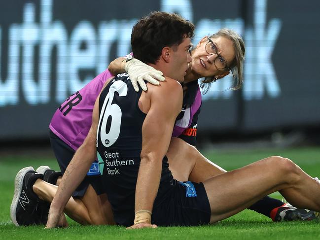 Jack Carroll of the Blues is checked on by trainers after a bump from Matt Crouch. Picture: Quinn Rooney/Getty Images.