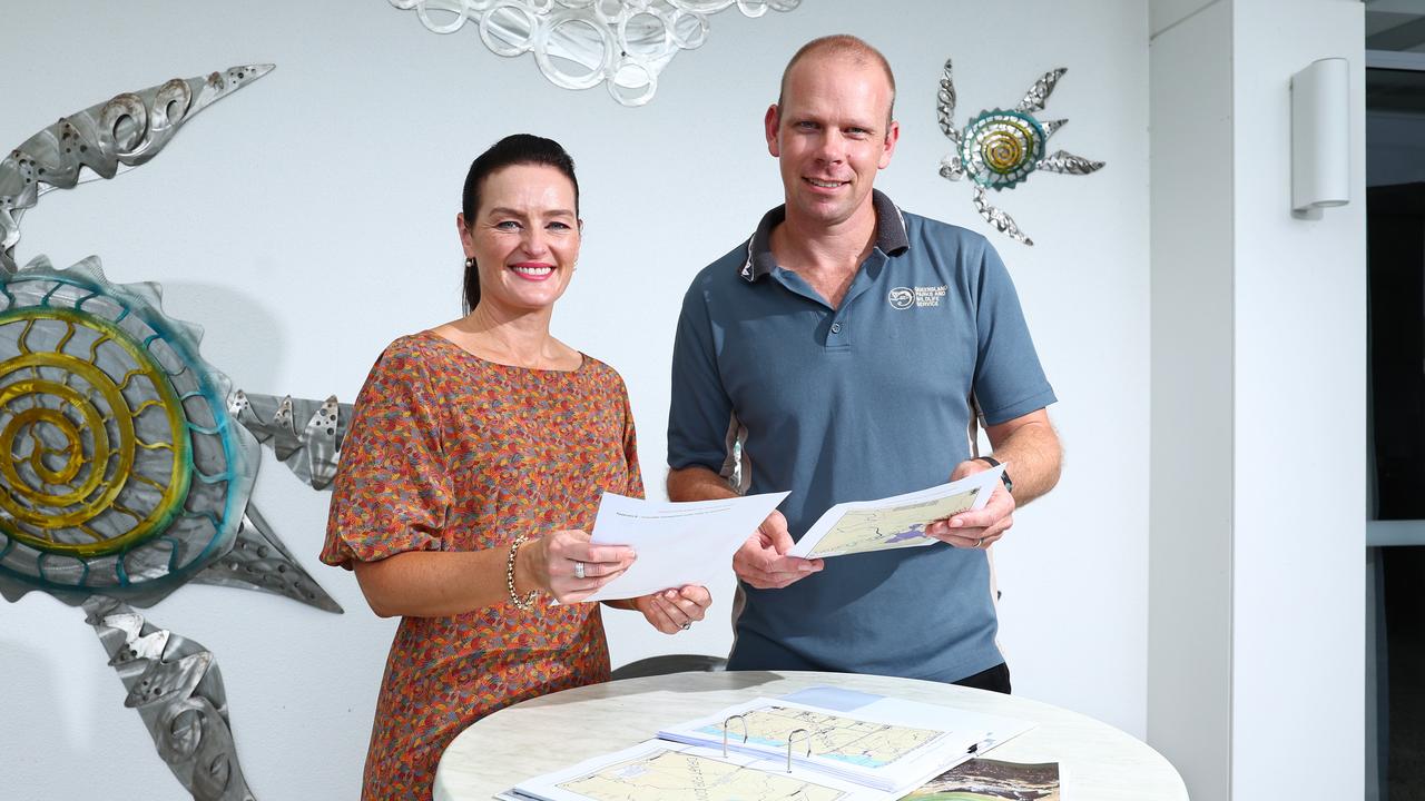 Minister Leanne Linard and Department of Environment and Science program co-ordinator for wildlife research and monitoring Simon Booth look over the draft papers for the plan, which is now open to public consultation until June 5. Picture: Brendan Radke