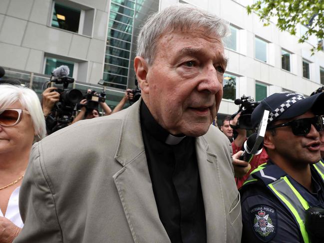 Cardinal George Pell leaves the County Court of Victoria.