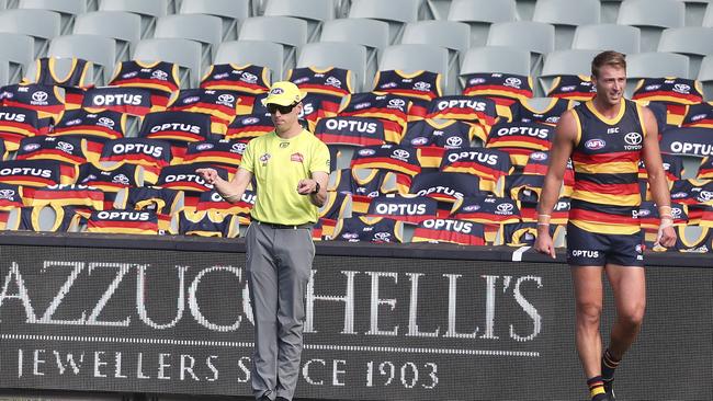 Daniel Talia in front of an empty bay of seats with Crows guernseys at Adelaide Oval on Saturday. Picture: Sarah Reed.