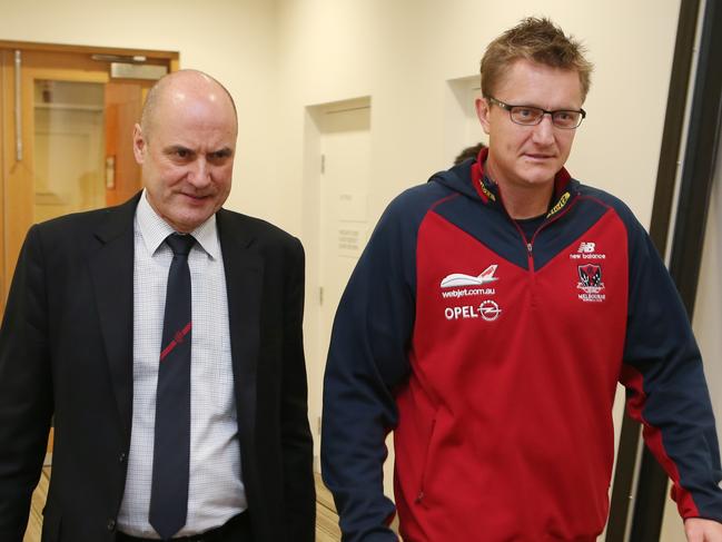 CEO Peter Jackson and Melbourne Demons  AFL football coach Mark Neeld arrive at a press conference in Melbourne where it has been announced that Mark Neeld has been sacked as the club coach. Monday, June 17, 2013. The sacking of Neeld follows a poor season by Melbourne where they have only won one game for the season. (AAP Image/ David Crosling) NO ARCHIVING