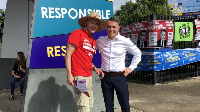 Forde Labor candidate Des Hardman greets campaign supporters at the biggest polling booth in Coomera.