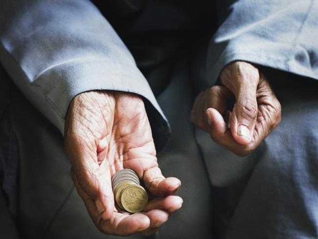 Begging hands with coins