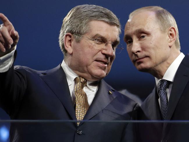 International Olympic Committee President Thomas Bach, left, and Russian President Vladimir Putin watch the closing ceremony of the 2014 Winter Olympics in Sochi, Russia on February 23, 2014.