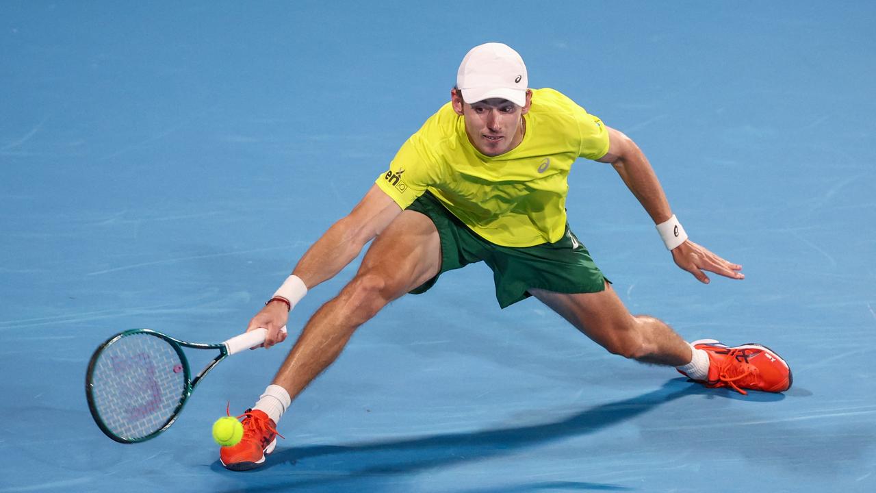 Australia's Alex de Minaur hits a return against Germany's Alexander Zverev during their men's singles match at the United Cup tennis event on Ken Rosewall Arena in Sydney on January 6, 2024. (Photo by DAVID GRAY / AFP) / — IMAGE RESTRICTED TO EDITORIAL USE – STRICTLY NO COMMERCIAL USE —