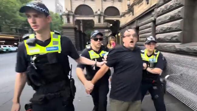 Mark Kuper was dragged away by police. Picture: Box4/YouTube