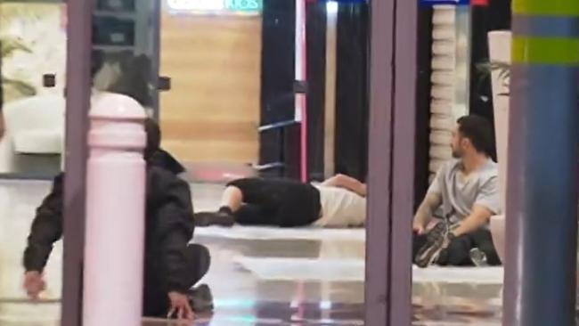 Footage of the training drill showed a person lying on the floor inside the centre. Picture: 7NEWS