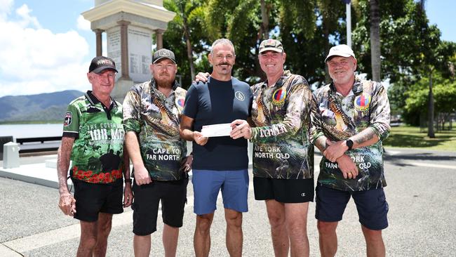 Veteran Adrian Spencer's son Alec was involved in a motorcycle accident and flown to Brisbane for medical treatment. Fellow veterans from the Pandanus Park War Veteran’s Retreat members Noel "Buzz" Berzinski, Chris Stacey, Roly Walker and Phil Wray have fundraised to help Adrian (centre) cover his travel and accommodation costs while in Brisbane. Picture: Brendan Radke