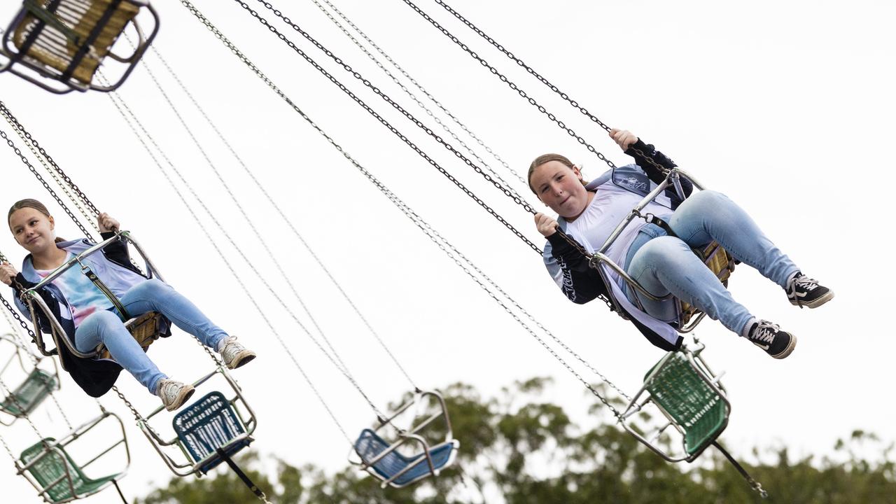 Olivia Sheward (left) and Isabella Horder on a ride at the 2022 Toowoomba Royal Show, Saturday, March 26, 2022. Picture: Kevin Farmer