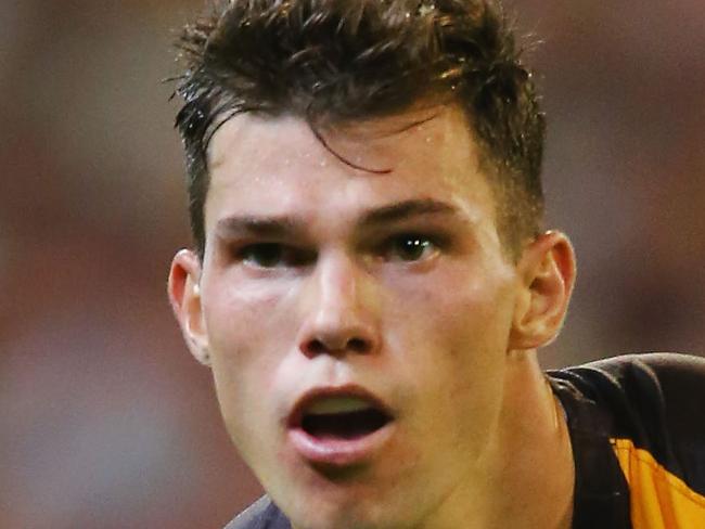 MELBOURNE, AUSTRALIA - MARCH 25:  Jaeger O'Meara of the Hawks handballs during the round one AFL match between the Essendon Bombers and the Hawthorn Hawks at Melbourne Cricket Ground on March 25, 2017 in Melbourne, Australia.  (Photo by Michael Dodge/Getty Images)