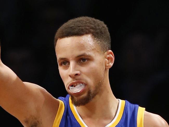 Golden State Warriors guard Stephen Curry (30) reacts after scoring in the second half of an NBA basketball game against the Brooklyn Nets, Sunday, Dec. 6, 2015, in New York. Curry had 28 points as the Warriors defeated the Nets 114-98. (AP Photo/Kathy Willens)