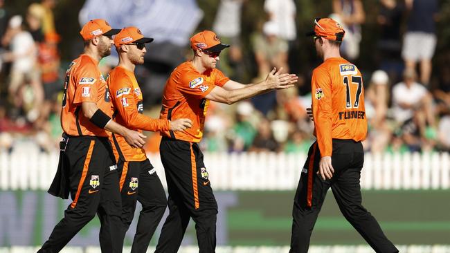 MELBOURNE, AUSTRALIA – JANUARY 02: Perth Scorchers players celebrate a wicket in a Covid safe manner during the Men's Big Bash League match between the Melbourne Stars and the Perth Scorchers at CitiPower Centre, on January 02, 2022, in Melbourne, Australia. (Photo by Darrian Traynor/Getty Images)