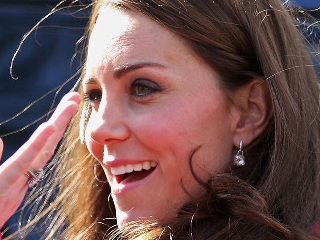 Britain's Catherine, Duchess of Cambridge waves as she leaves after a visit to the XLP Mobile Recording Studio on March 27, 2015 in south London. In 2008 XLP, EMI, MTV and the Met Police collaborated to create the X-Mobile studio. Converted from an old police riot van as part of MTV’s “Pimp My Ride” TV show this superbly equipped mobile recording studio has since been working in schools, pupil Referral Units and on estates. AFP PHOTO / CHRIS JACKSON / POOL