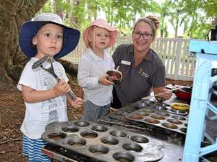 GETTING HANDS DIRTY: Playgroup regional representative Michelle Poole with attendees Louis and Clemi at the new mud kitchen. Picture: Eden Boyd