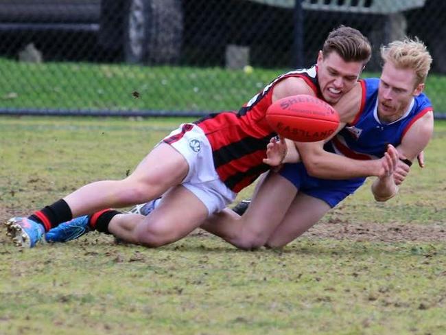 Jason Want is wrapped up in a tackle on Saturday. Picture: Steve Bibby