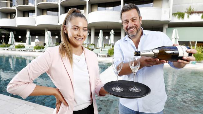 New staff member Maddison Brennan and Simon Gloftis owner of Hellenika and SK Steak and Oyster at the Calile Hotel. Picture: Josh Woning)