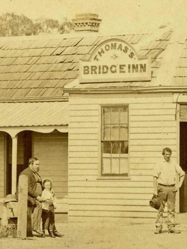 The original Thomas' Bridge Inn Hotel. Moses is sitting on the left with his son. Photo: Lost Mernda Facebook Page.