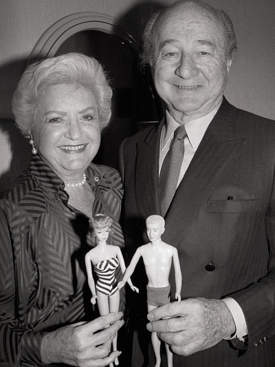 Ruth and Elliott Handler, the couple who introduced the Barbie doll in 1959, holding a Barbie and Ken doll.