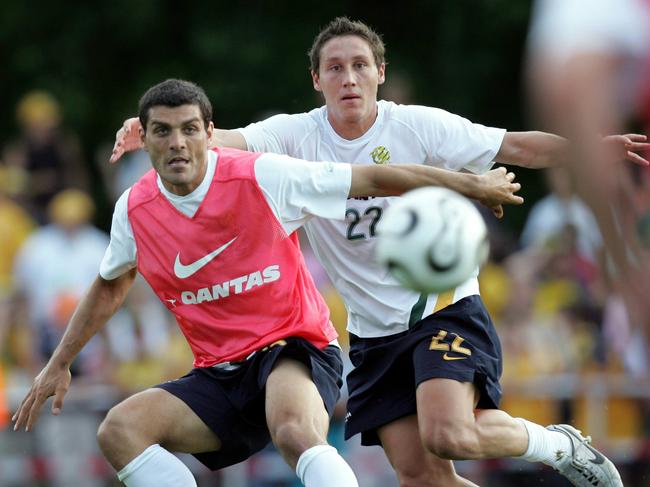 A fresh-faced Mark Milligan jousts with John Aloisi in 2006. Picture: Gregg Porteous