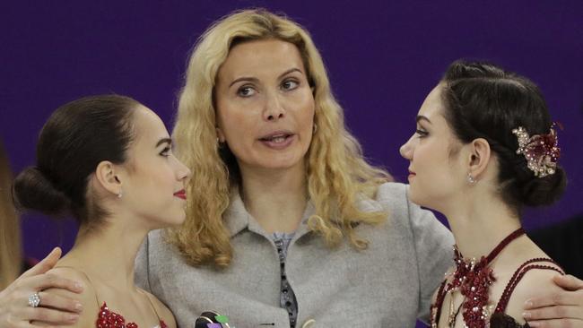 Eteri Tutberidze (centre) coaches both gold medallist Alina Zagitova, left, and silver medallist Evgenia Medvedeva. Photo: AP