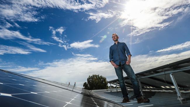 Finn Peacock surveys the solar panels at NRG Solar. Picture: Kelly Barnes