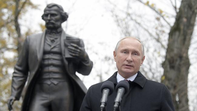 Vladimir Putin unveils a statue of Russian novelist Ivan Turgenev to mark the writer's 200th birth anniversary in Moscow on Saturday. Picture: AP