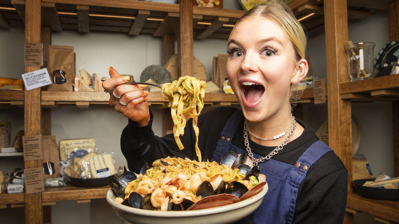 Lily Hopper 19, gets set to tuck into a bowl of chilli and rapini tagliatelle ai frutti di mare at The Stores Grocer in West End. Picture: Lachie Millard.