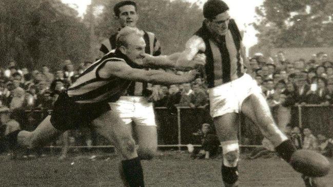 Ovens and Murray champion Neville Hogan, right, playing for Wangaratta Rovers against Wangaratta in the 1960s. Picture: Supplied