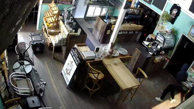 CCTV footage from inside Liberty Providore at Urunga on September 16 shows one thief wearing white shoes and black clothing. Picture: Supplied