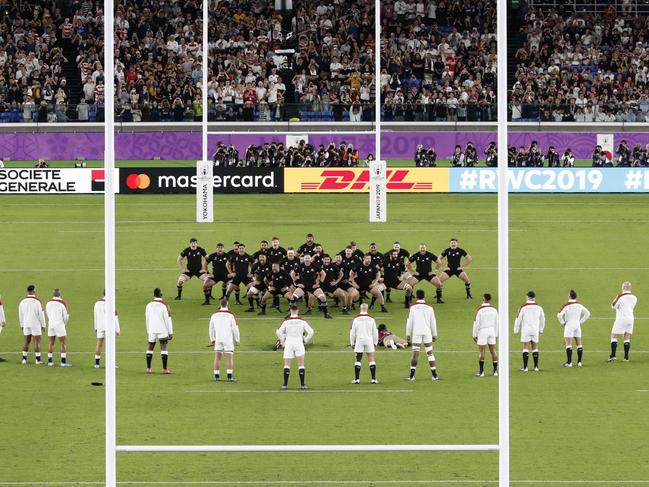 England players watch the All Blacks perform their haka during the Rugby World Cup semifinal at International Yokohama Stadium between New Zealand and England in Yokohama, Japan, Saturday, Oct. 26, 2019. (Kyodo News via AP)