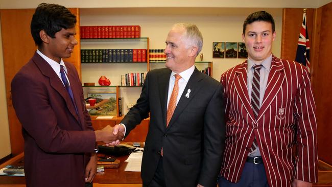 Indigenous students Matthew McDonald (left) from Western Australia and Wyatt Cook-Revell from Queensland, winners of the Australian Indigenous Education Foundation (AIEF) "If I were PM" competition call on Prime Minister Turnbull in his Parliament House office in Canberra.