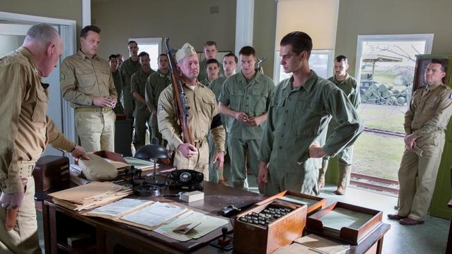 Actors L-R Robert Morgan, Vince Vaughn, Nico Cortez, Daniel Thomlinson, Goran Kleut, Luke Pegler, Milo Gibson, (extra), Harry Greenwood, Firass Dirani, Richard Pyros, Luke Bracey, Andrew Garfield, Jacob Warner and Sam Worthington during a scene from director Mel Gibson's Hacksaw Ridge, currently filming in New South Wales (pic: Mark Rogers).